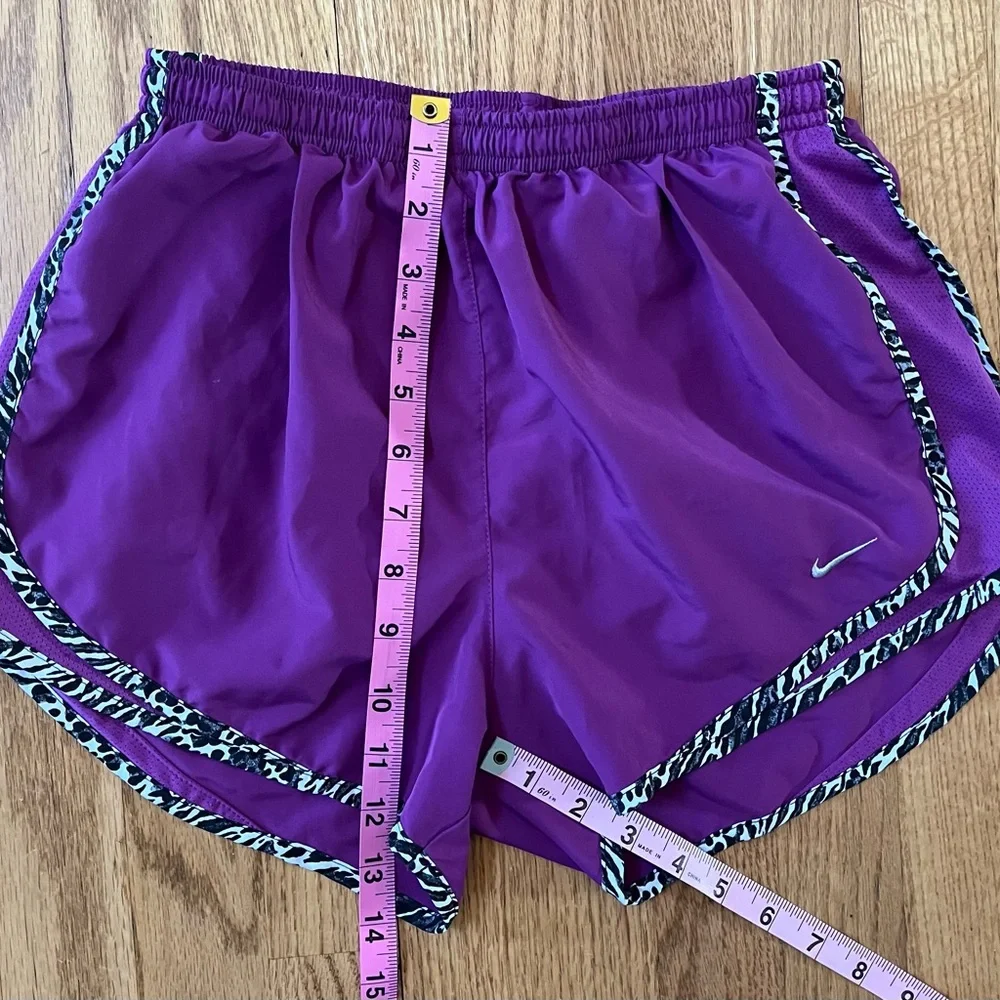 Women’s purple Dri-Fit Nike running shorts with animal print